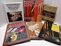 Six vintage furniture and decorating books arranged flat and standing upright, showing the front covers clearly.