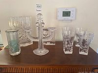 Overview of all glassware including the candelabra, vases, and drinking glasses