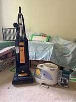 Sebo vacuum and Bionaire humidifier together showing size and condition