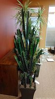Full view of the 68 inch tall faux plant in decorative planter, showing the tall cactus-style stems and variegated leaves.
