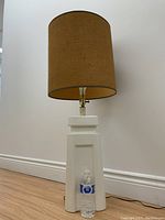 Full view of vintage Mid-Century Modern ceramic lamp with original brown fabric shade, water bottle at base for scale.
