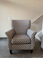 Front view of the cream-colored Palmview chair with black diamond pattern.