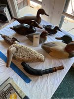 All six decoys arranged on table with two calls visible
