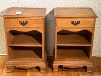 Pair of matching solid maple nightstands side by side showing front, drawer and shelf details