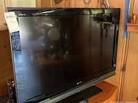 Sony Bravia 40-inch flat screen TV, black, shown from front with screen off