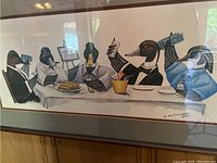 Framed artwork depicting ducks at a dining table holding money and food, showing overall composition and framing.