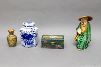 Full view of all four items on grey background, showing arrangement and scale