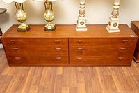 Full front view of dresser showing six drawers and integrated wooden pulls