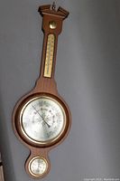 Full view of vintage wooden wall barometer/thermometer/hygrometer decorative piece