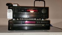 Denon DRA-295 receiver stacked on DCM-270 CD changer, with remote and antenna visible