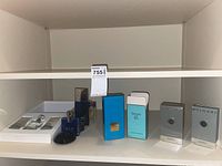 Shelf view showing Bvlgari gift set, BLV Pour Homme, boxed Tom Ford and Tiffany.