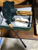 Bagpipes partially assembled in soft zippered case, showing bag, drones and chanter