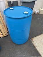 Single blue rain barrel standing upright showing sealed top with two white screw caps.