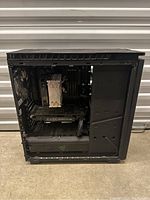 Open side panel view showing internal components including GPU, CPU cooler, drive bays