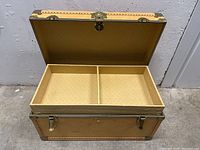 Open wooden chest showing removable tray with two compartments inside. Beige patterned lining inside chest and tray.