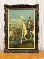 Full frontal view of the framed oil painting depicting medieval cavalry scene