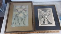 Both framed prints side by side showing size difference and framing details