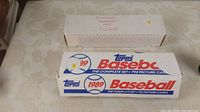 Two closed boxes labeled Donruss Baseball 1987 complete and Topps Baseball 1989 with 792 cards each.