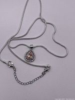 Sterling silver snake chain with lobster clasp and extension chain, teardrop pendant attached