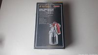 Box showing Astro Pneumatic Tool 4008 spray gun with cup and 1.6mm red handle nozzle.