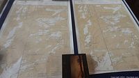 Two large nautical maps laid flat side by side, showing geographic and waterway details of the Rideau Waterway area.