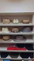 Five-shelf unit displaying eleven hats on shelves