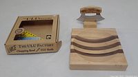 The lot with large chopping bowl, Ulu knife, and original box packaging.