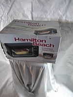 Box of Hamilton Beach convection toaster oven showing brand logo and product image.