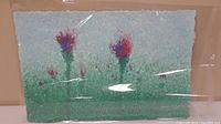 Front view of the paper pulp painting showing blue-green background with abstract red and purple floral shapes.