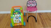 Photo of Little Tike toddler walker and pink infant high chair side by side on wood floor.