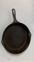 Top view of cast iron skillet showing cooking surface and handle with #10 stamp.