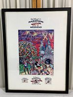 Full view of the framed 2008 Walt Disney World Marathon poster with artwork, title, and marathon logos at bottom.