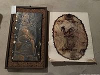 Overall view of both the framed totem painting and the indigenous art poster placed side by side on the floor.