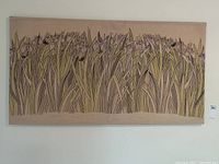 Front view of the large textile art piece showing an illustration of a field of irises in muted colors on fabric or canvas.