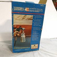 Blue box of Campbell Hausfeld DH6500 automotive spray gun with product image and description, visible wear on box edges.