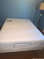 Full view of mattress on adjustable base with performance protector cover