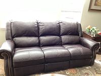 Front view of full three-seat sofa showing overall condition and upholstery color