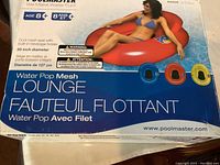 Front and top box view showing the Poolmaster branding, model name Water Pop Mesh Lounge, and an image of a woman using the red-colored float, mentioning the mesh seat and beverage holders.