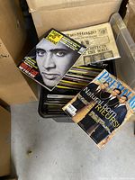 Top view showing Original Premiere magazines inside a file box with visible covers featuring celebrities and movie themes, plus a Sight and Sound magazine.