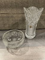Cristal D'Arques crystal vase and crystal bowl set photographed on floor in front of couch.