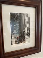 Full view of the framed black and white photograph showing the composition and frame details.
