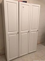 Front view of three closed cabinets showing overall appearance and finish