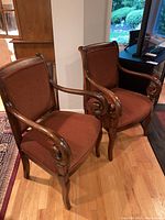 Two armchairs shown from front quarter angle