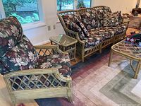 Full view showing couch, chair and coffee table with end table in foreground
