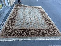 Full view of rug laid flat showing overall pattern and colors