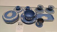 Overview of all Wedgwood jasperware pieces including candle holders, cup and saucer, lighter, two bowls one with lid