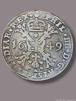 Obverse side of the 1649 King Philip IV silver coin showing crowned crowned arms and date 1649.