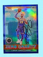 Front view of holographic Silver Prizm Zero Gravity card showing LeBron James dunking in Lakers uniform with black autograph