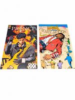 Top view of the two comic books side-by-side showing covers; one Prince comic and one Michael Jackson comic