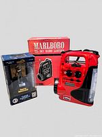 Photo showing Marlboro radio lantern and Sports Illustrated Babe Ruth figurine in original packaging